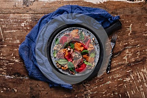 top view of delicious salad with mussels and vegetables on wooden